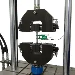 Tension testing of a composite with extensometer