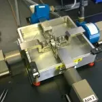 Planar biaxial machine with fluid bath